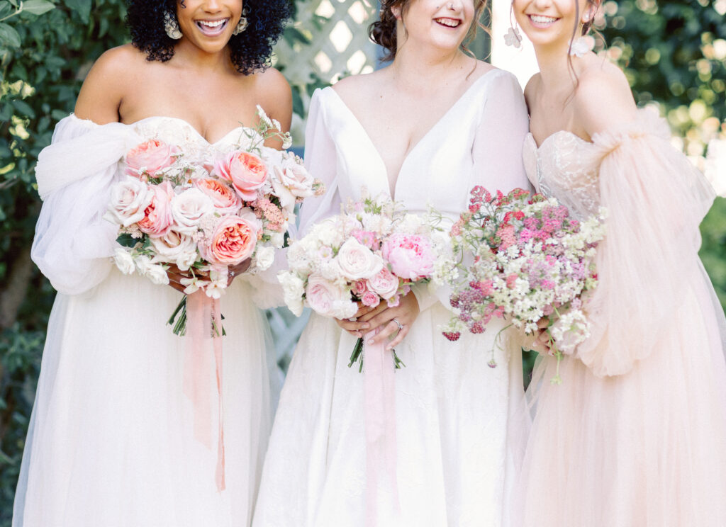 Spring wedding, brides holding bouquet, wedding gowns